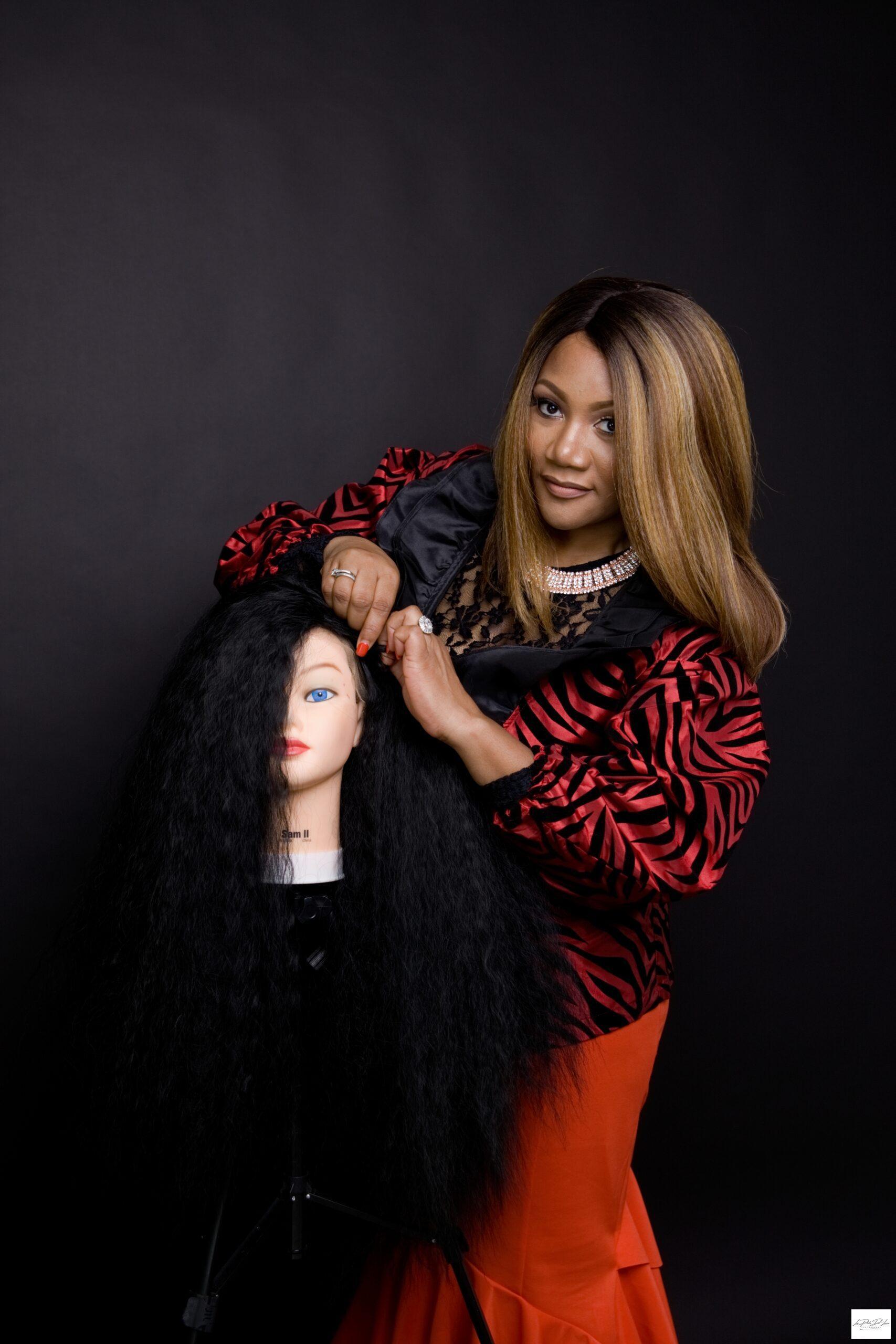 Black Female Wig Designer working on her wig