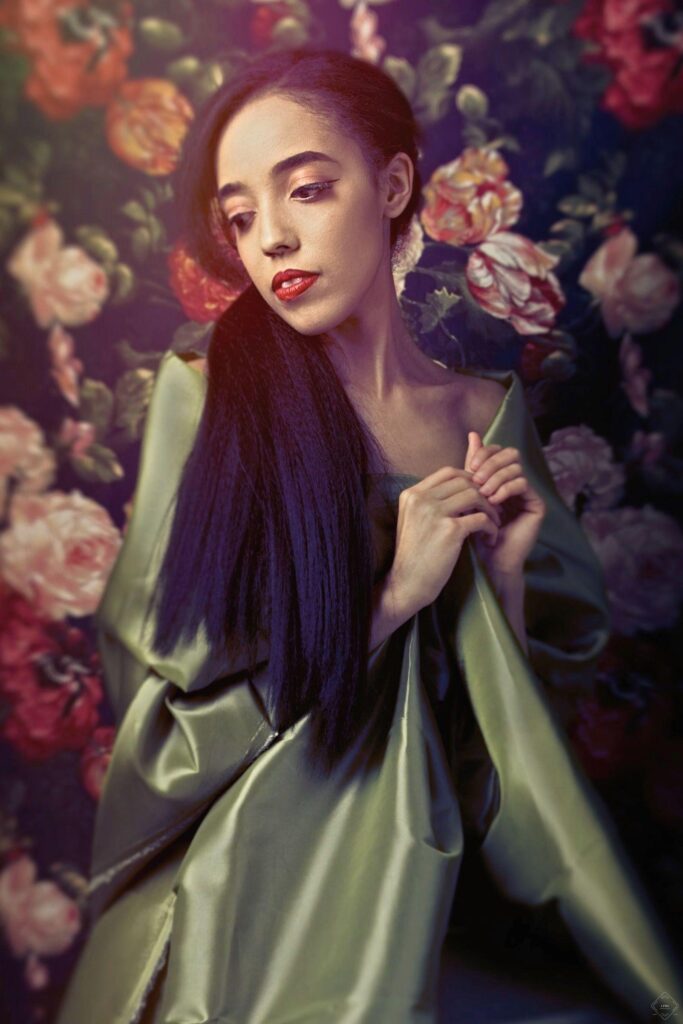 Asian woman Wrapped in green Satin posing for her portrait