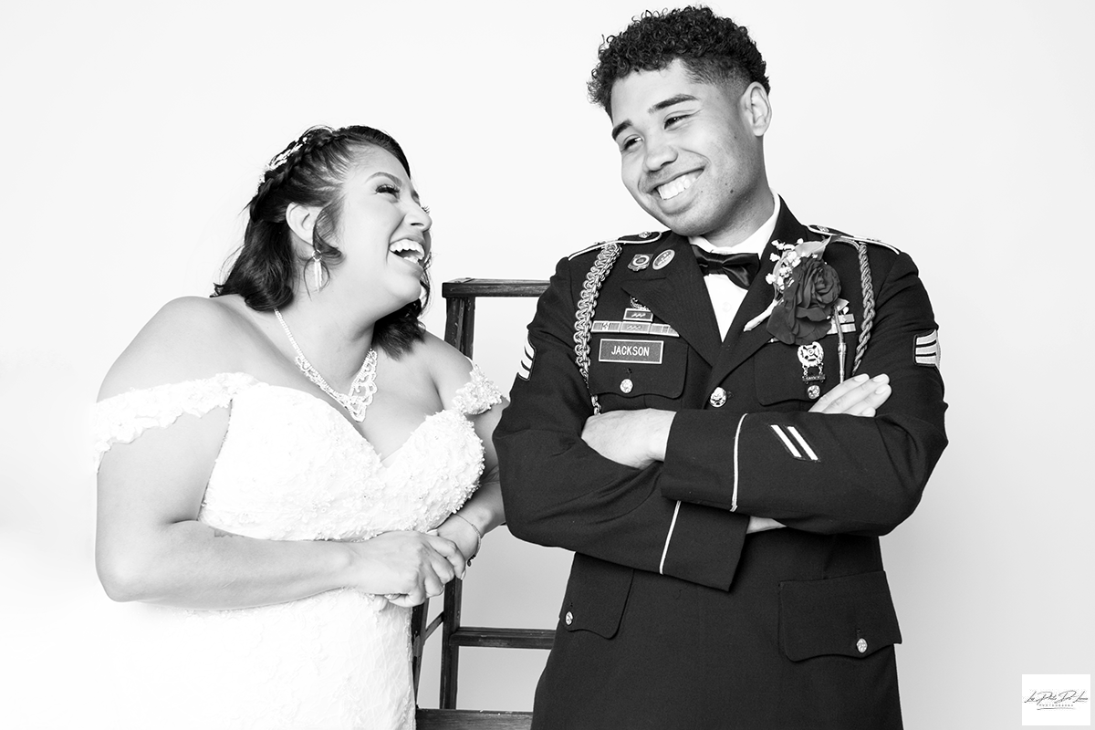Bride and Groom laughing full of joy in a black and white portrait