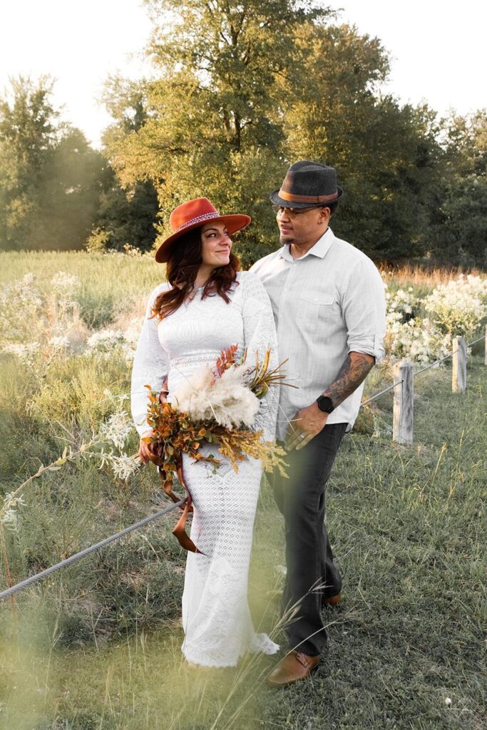 Mixed couple standing in flower field