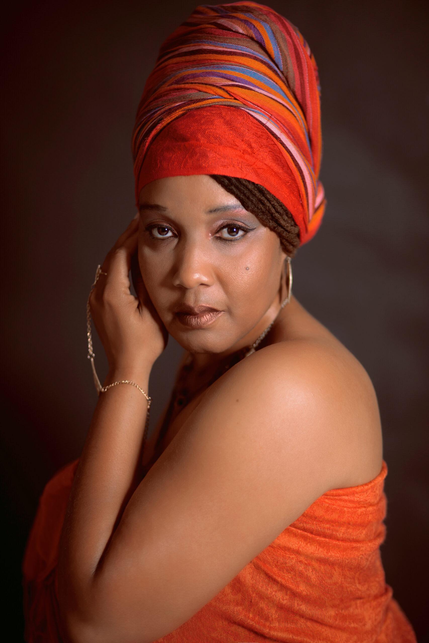 Black Woman with braids and red turban