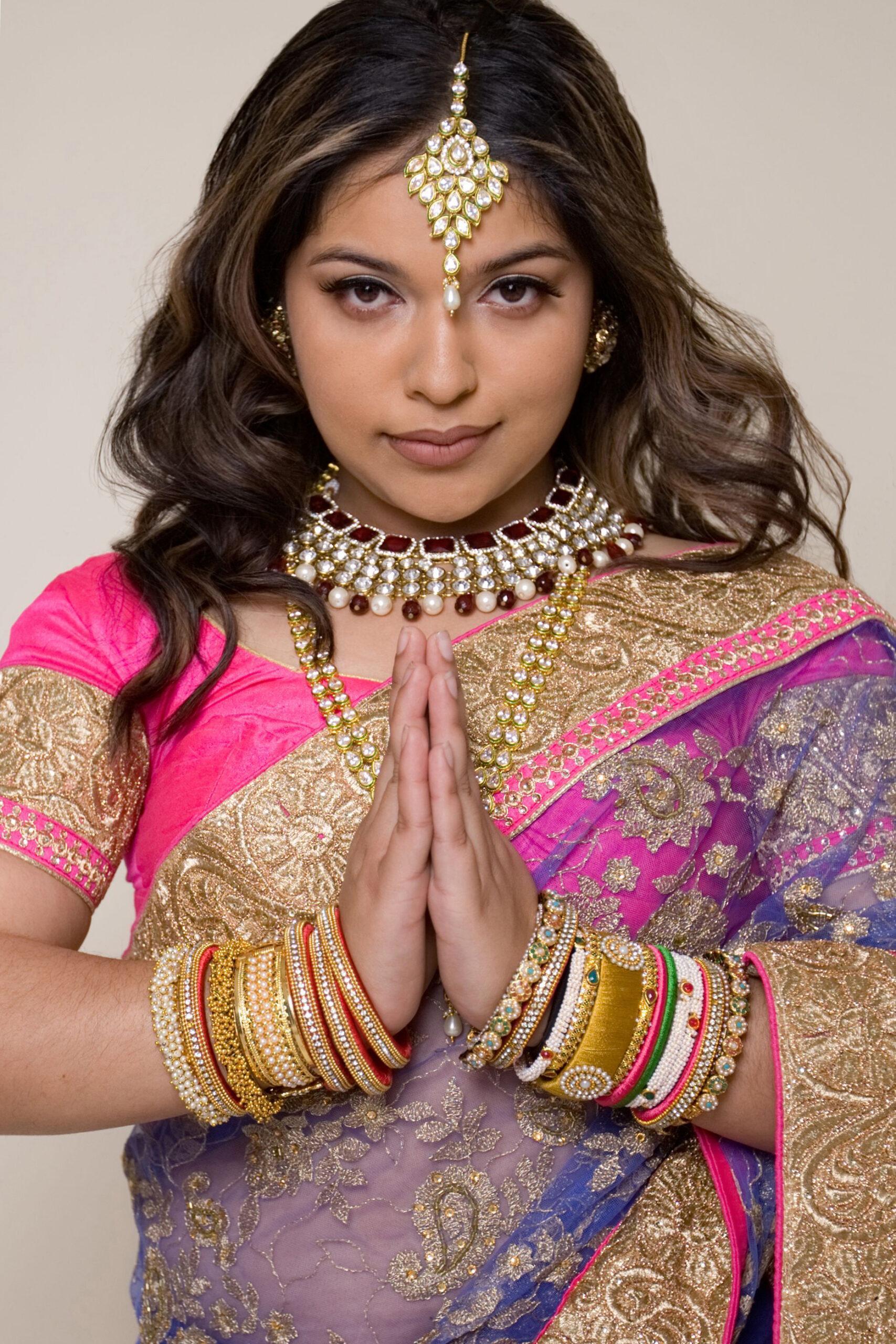 Indian Woman posing in her colorful sari and jewelry